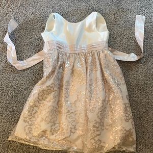 Cleaning out daughters closet. Beautiful formal cream dress. Worn probably once.